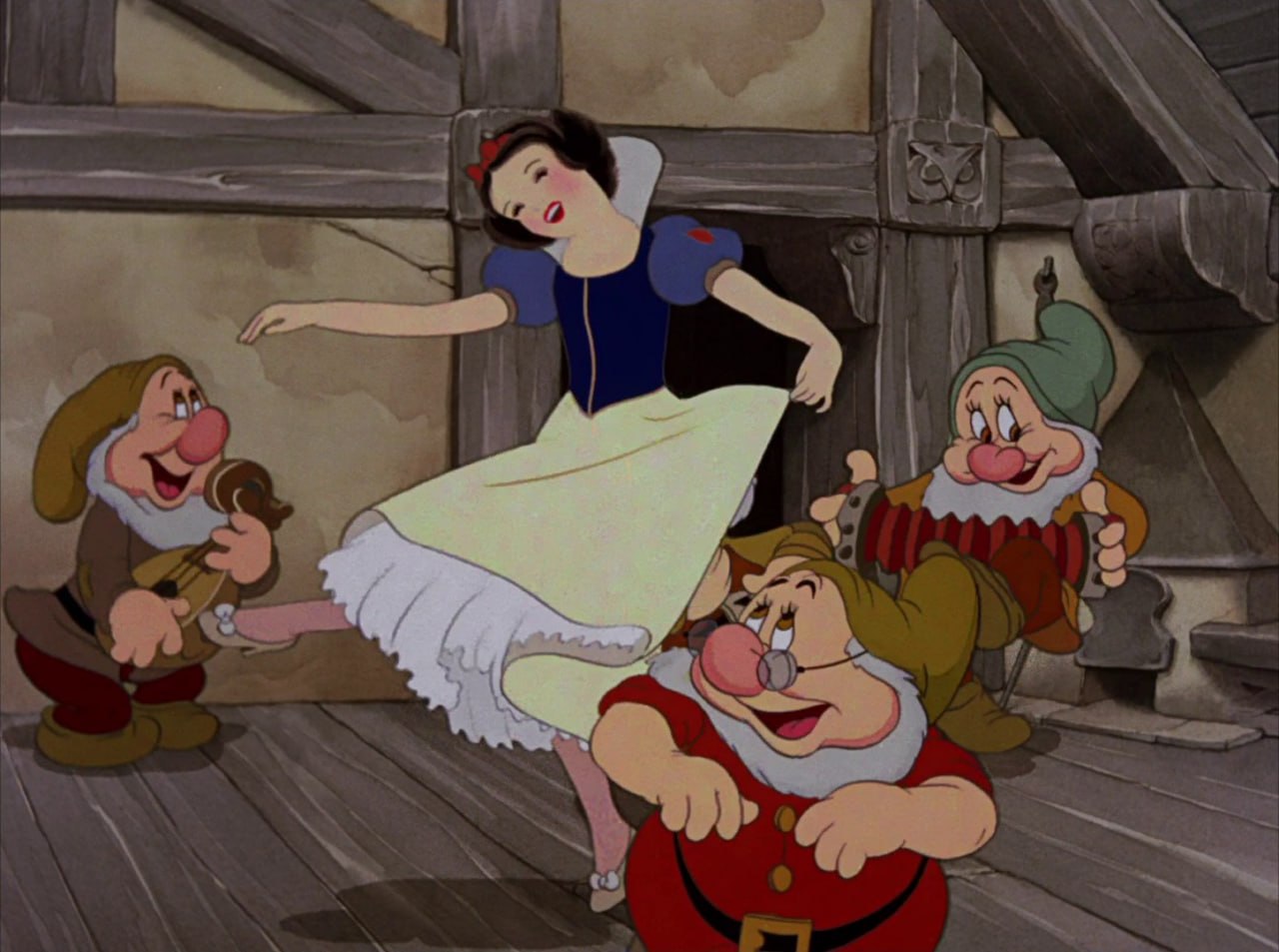 Белоснежка танцует с гномами — кадр из мультфильма Disney 1937 года